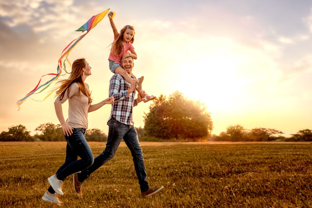 happy osteopath treatment in wimbledon - family of clients with back pain